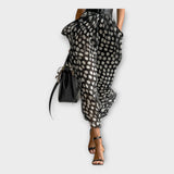 Vestido comprido com estética sofisticada e intemporal