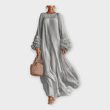 Vestido comprido e arejado com detalhes elegantes